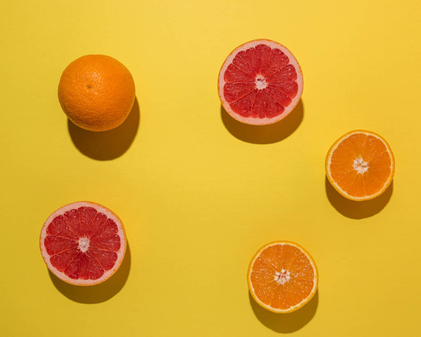 Creative fruit composition on yellow background with hard shadows. Summer minimal concept. - Foto, Bild