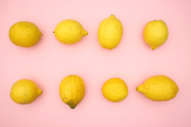 Lemons on pink background  - Foto, Imagen