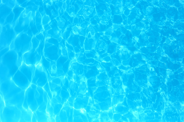 Blue color water in swimming pool rippled water detail backgroun - Photo, Image