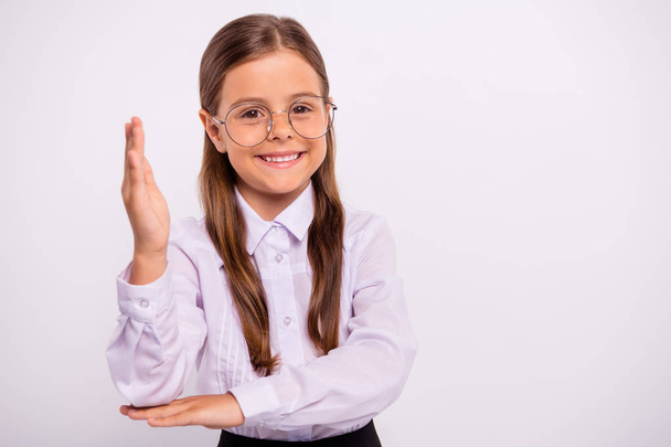 Close-up portrait of her she nice attractive lovely sweet winsome intelligent cheerful cheery pre-teen girl raising hand up yes a-mark isolated over light white grey background - Foto, Imagen