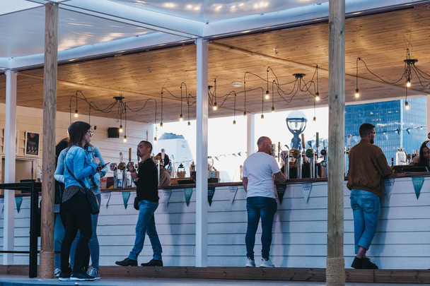 People ordering drinks from a bar at the Summer by the River 201 - Photo, image