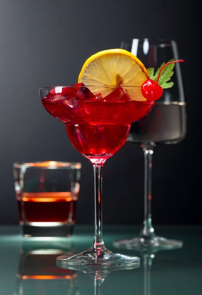 Various alcoholic drinks on a black background. - Foto, imagen