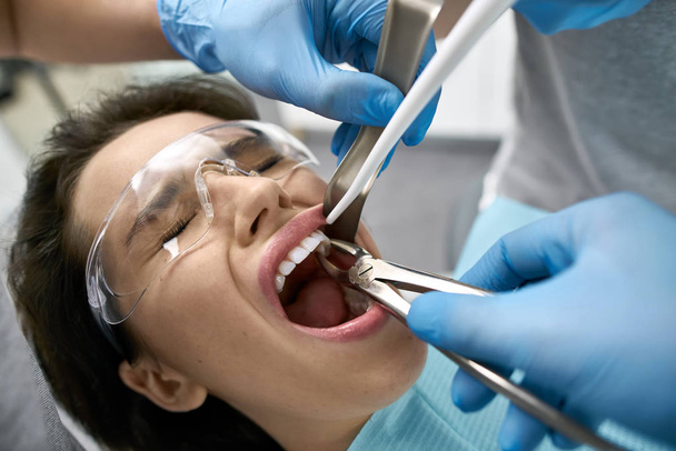 Pretty womans teeth treatment in dental clinic - 写真・画像