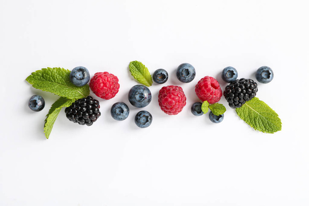 Flat lay composition with berries on white background, space for - Valokuva, kuva