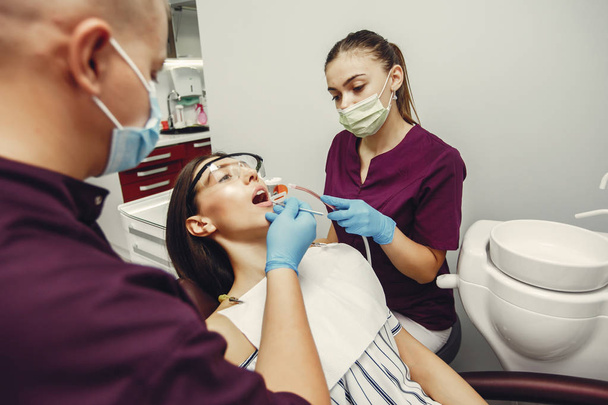 Beautiful girl in a dentist - Фото, изображение