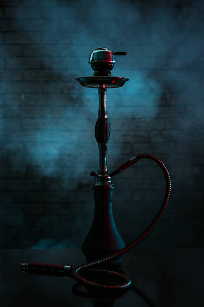 Hookah with fume on dark background - Фото, изображение