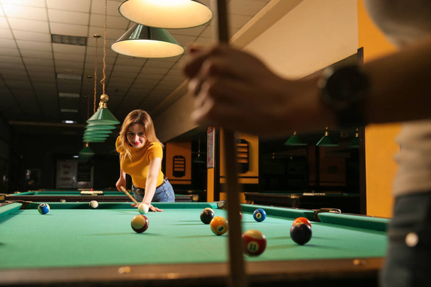 Young women playing billiard in club - Photo, Image