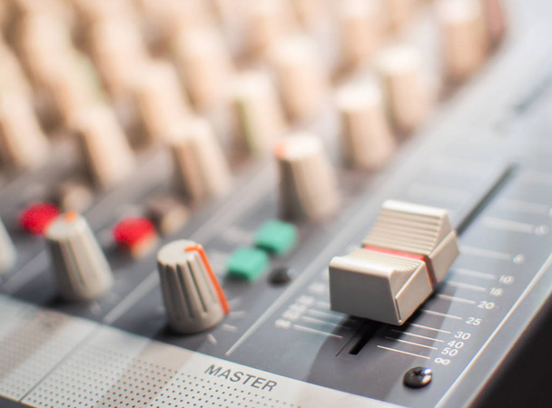 Sound equalizer mixing. Professional studio equipment for sound mixing. Music studio image. Close up and selective focus. - Foto, Imagem