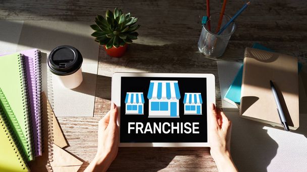 Franchise business model and growth concept on device screen. - Foto, Imagen