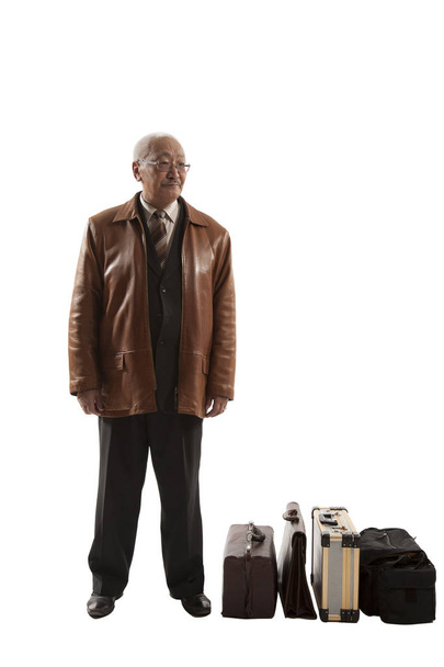 Elderly Asian man with suitcases - 写真・画像
