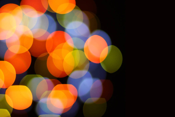 Christmas and happy new year on a blurred bokeh. Glare blurred blank background. - Photo, Image