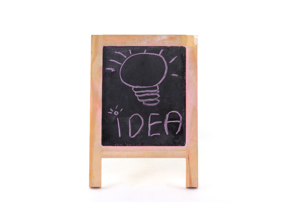 Bulb idea on black board - Photo, Image