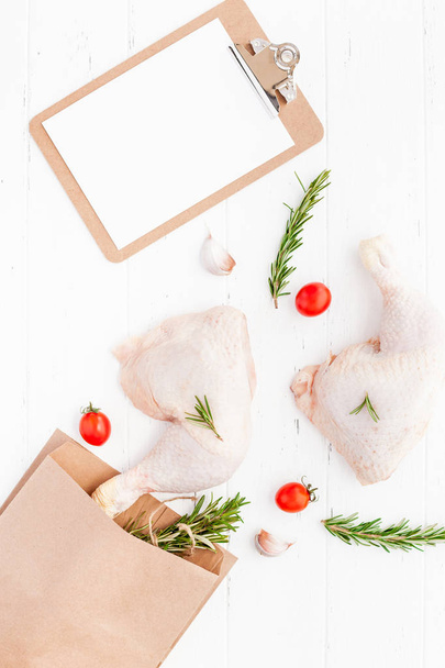 Fresh raw chicken legs with herbs. Cooking concept - Photo, Image
