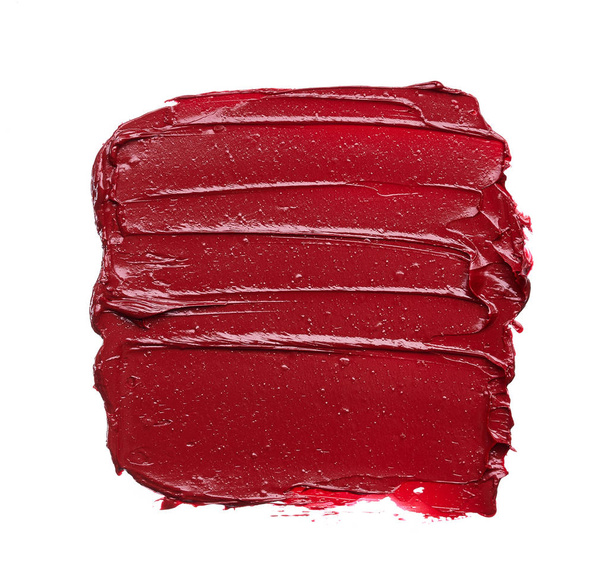 Smear and texture of red lipstick or acrylic paint isolated on white background. - Valokuva, kuva