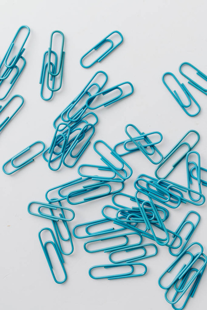 pile of colorful paper clips on white background, flat lay - Photo, Image