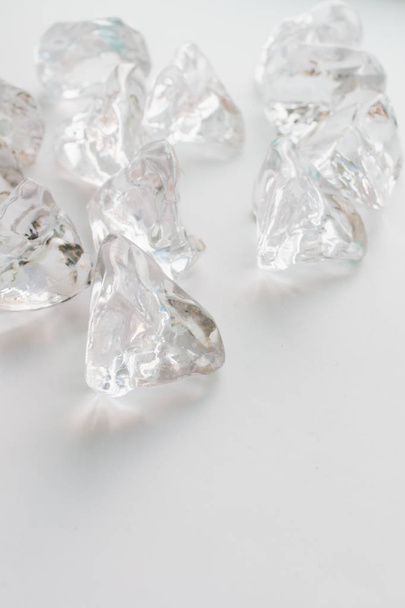 scattered crystals on white background, beautiful gems - Foto, Imagem
