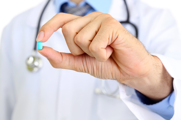 Medical doctor giving you a pill - Valokuva, kuva