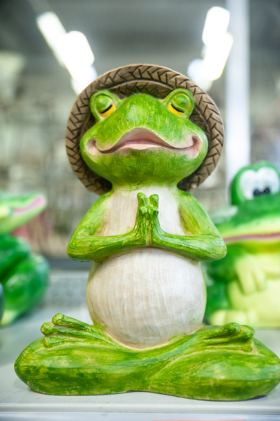 Funny frog figurine in yoga pose, meditation - Photo, Image