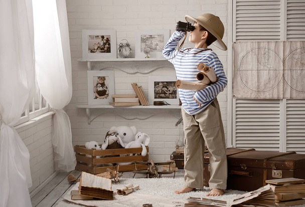 Boy in the image of sailor playing in her room  - Photo, Image