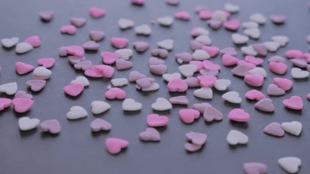 Valentines Day heart shaped candy on black background - Metraje, vídeo