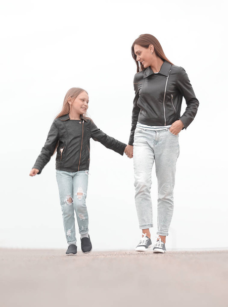 portrait of a mother and daughter walking together - Foto, imagen