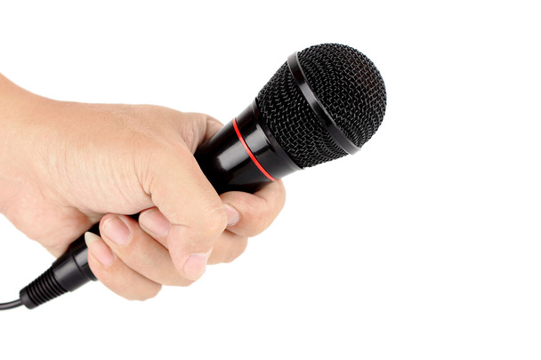 Hand holding black microphone - Fotó, kép