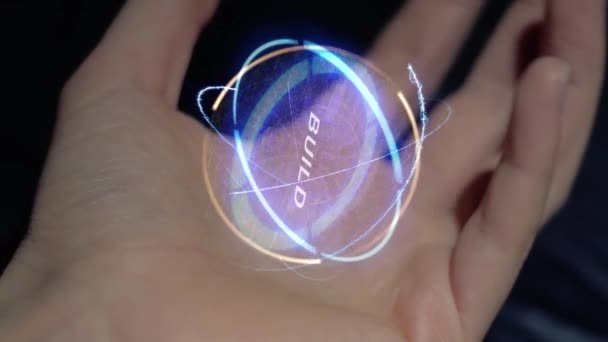 Build text hologram on a female hand - Footage, Video
