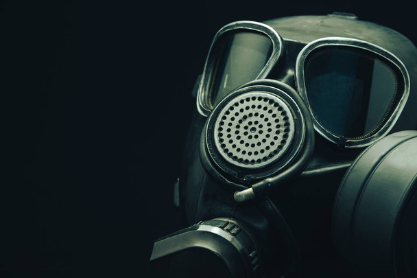 Close up Gas mask on a black table and dark background.  - Foto, immagini