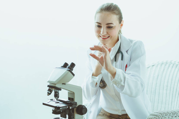 Scientist with microscope - Фото, изображение