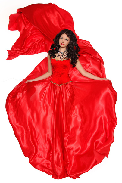 Beautiful woman in red dress isolated on white background. Studi - Фото, зображення