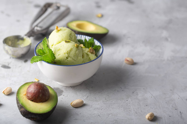Homemade organic avocado and mint ice cream in a bowl with copy space - Fotó, kép