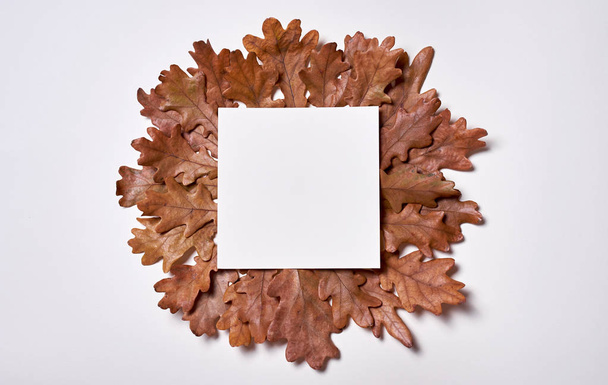 Autumn composition. Wreath frame made of blank paper, autumn dri - Φωτογραφία, εικόνα