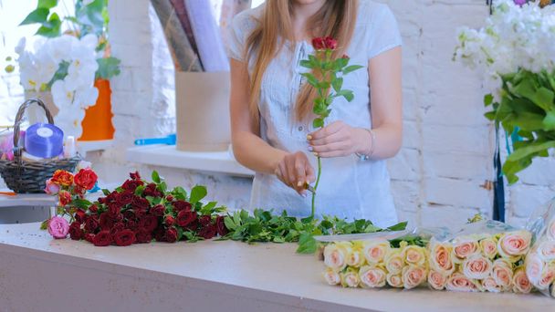 Professional florist working with flowers at studio - Photo, Image
