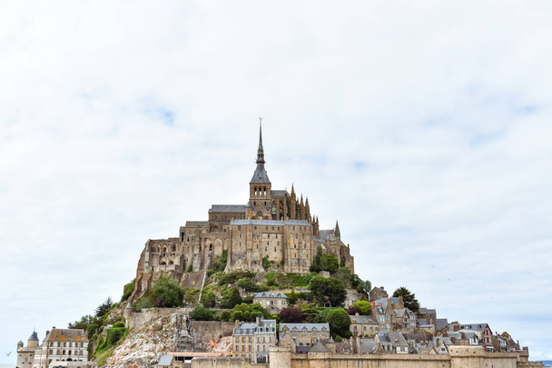 Close-up of Mont Saint Michel, France, in a cloudy sky. - Фото, зображення