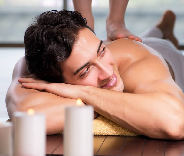 Young handsome man during spa procedure - Photo, Image
