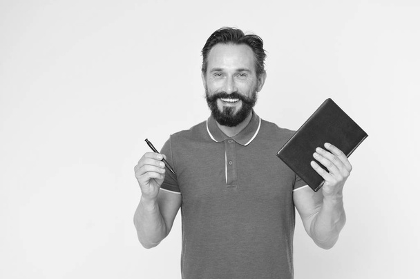 Mature hipster with beard. brutal caucasian hipster with moustache. Bearded man. Male barber care. writing new ideas. happy man with notebook and pen. Really busy. Analyzing sales pitch - Fotoğraf, Görsel