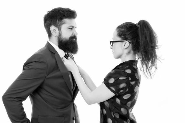 woman fix her man bowtie. formal business couple. business with personal assistant. elegant sexy woman fixing her lovers bowtie. Preparation for party. corporate party in office. mr perfection - Фото, изображение