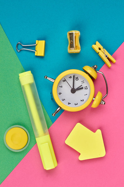 Yellow stationery supplies on color background. - Photo, Image
