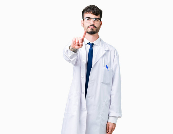 Young professional scientist man wearing white coat over isolated background Pointing with finger up and angry expression - Photo, Image