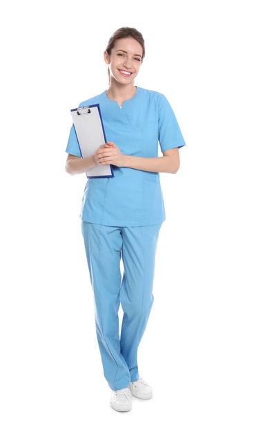 Full length portrait of medical doctor with clipboard isolated on white - Foto, Bild