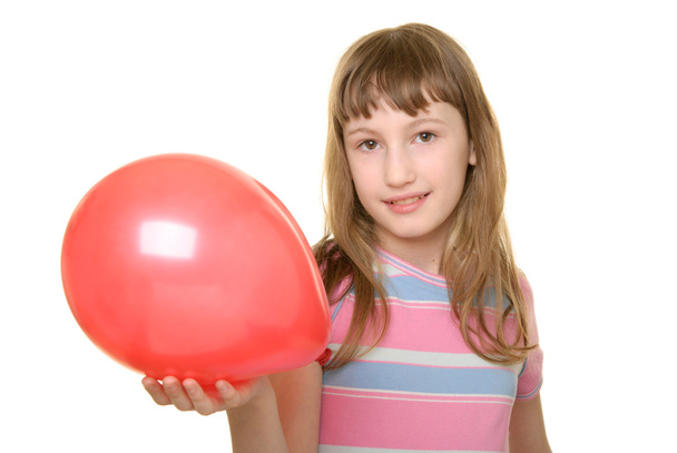 Girl holds red balloon on hand - Φωτογραφία, εικόνα