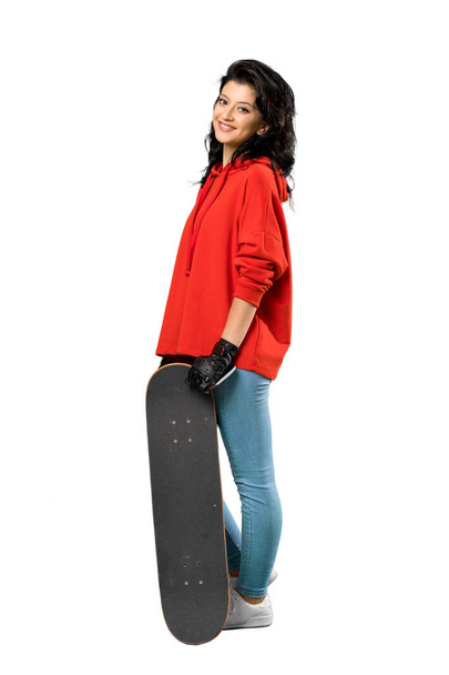 Young skater woman with red sweatshirt - Photo, Image