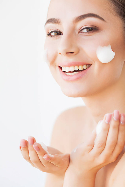 Beauty Face Care. Woman With Cream On Facial Skin - Foto, Imagem