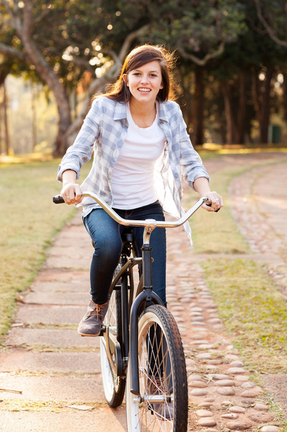 pretty teen girl riding bicycle - Foto, Imagen