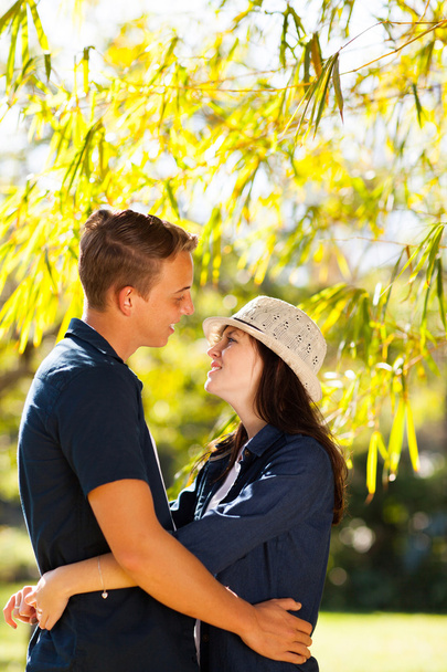 teenage couple hugging outdoors - Foto, afbeelding