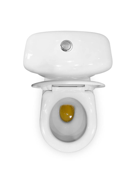 White ceramic toilet. Yellow urine in the toilet. The view from  - Фото, изображение