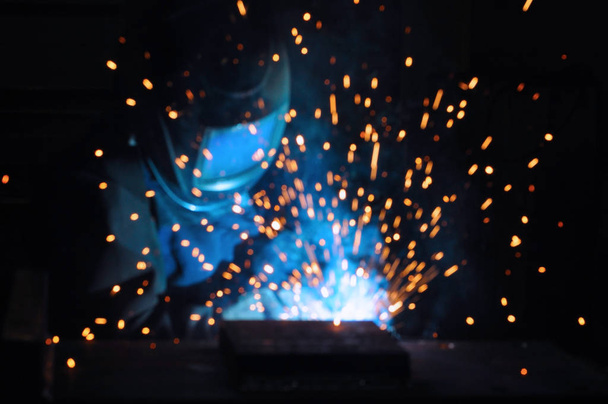 electric welder brews steel at the factory. - Фото, изображение