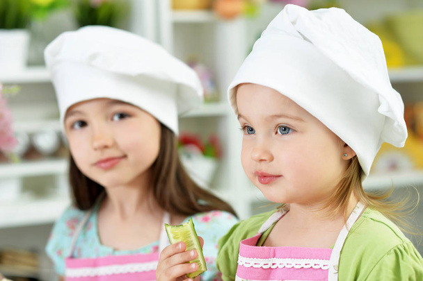 Cute girls cooking  in kitchen - Foto, Imagen