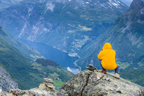 Tourist taking photo from Dalsnibba viewpoint Norway - Photo, image