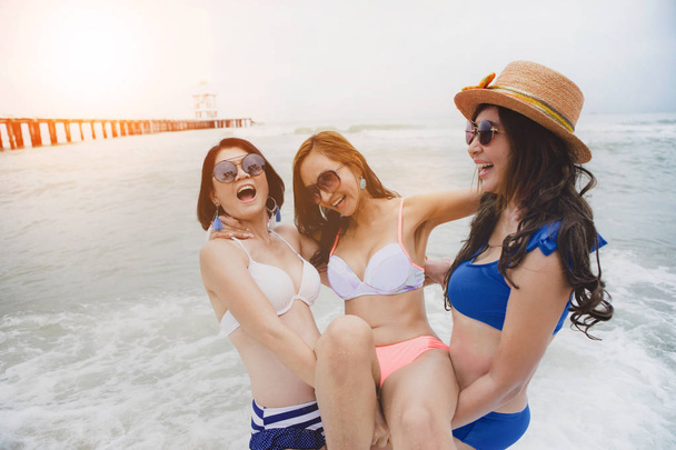 three bikini asian woman happiness with relaxing emotion in vaca - Фото, изображение